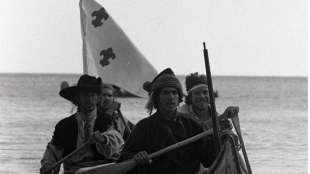 Richard Gross leads his canoe forward.