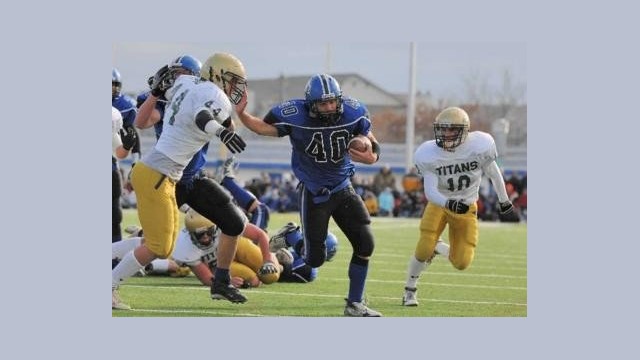 Janus stiff arms a defender.
