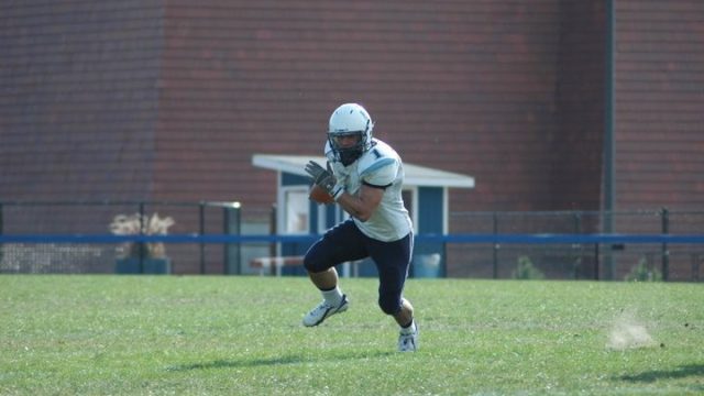 Janus in the open field while playing for Elmhurst.