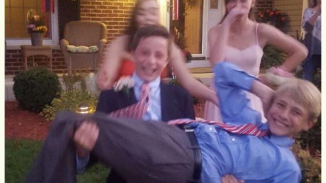 Graham carries Ted Gross, ‘19, for a homecoming picture.