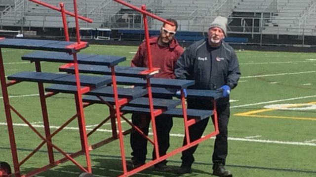 Swingman Zach Hamblen (left) and Ken Gaughan (right) set up for a track meet.