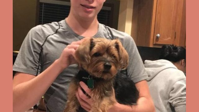 Graham holding Isha Rahmen’s, ‘19, dog.