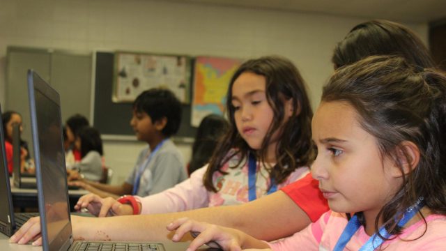 Students concentrating on the algorithm concepts being taught.
