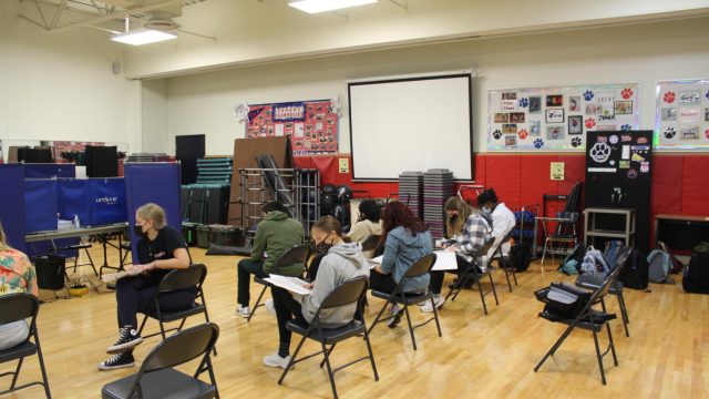 Donors read over important information before giving blood.