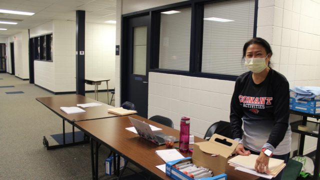 Medical Careers Club sponsor Victoria DeGuia stands outside the multi-purpose room, checking in donors.