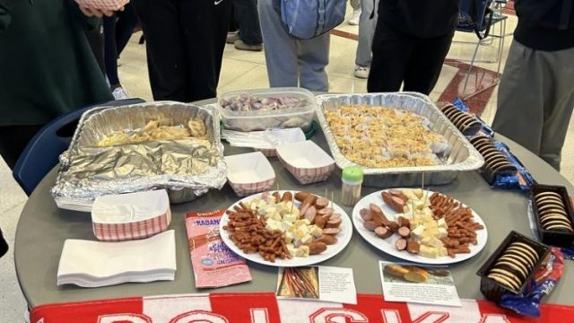 The Polish table, decorated with a Polish banner and a variety of dishes.